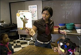 Cindy Mahese, a student at the Young Adult Borough Center at John Adams High School, conducts an exercise on planting seeds with young visitors to the Queens Botanical Gardens. Her internship at the gardens, three days a week, was arranged through her high school.