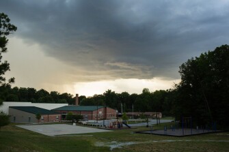 A summer storm lingers over Parkview Expressive Arts Magnet School in High Point, N.C. Parkview stands to lose several federal Race to the Top grants and other funding, which have spurred academic improvements at the school.