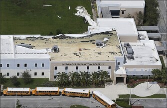 Part of the roof membrane atop the Everglades Preparatory Academy in in Homestead, Fla, was peeled away by winds from Hurricane Irma.