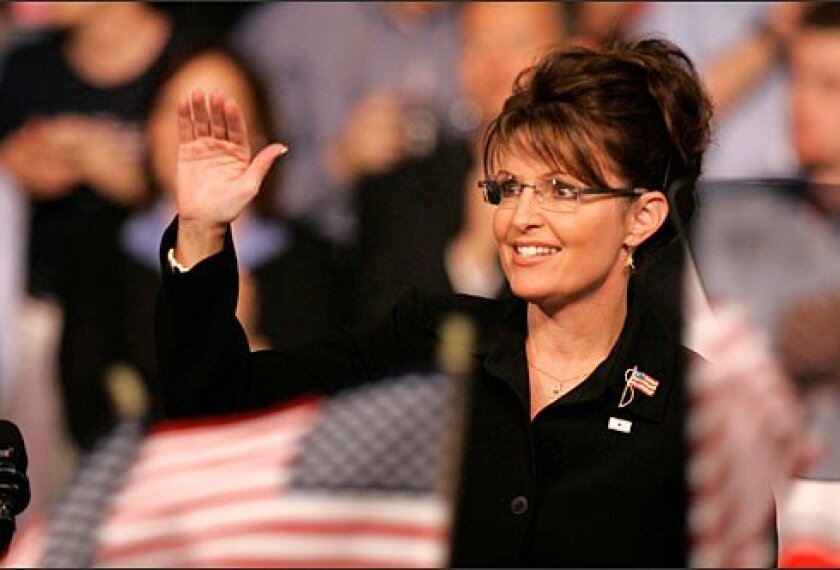 Alaska Gov. Sarah Palin acknowledges the crowd as Republican presidential candidate Sen. John McCain, R-Ariz., not pictured, introduces her as his vice presidential running mate on Aug. 29 in Dayton, Ohio.