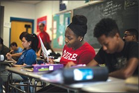 Students practice writing skills during an SAT Prep class at Franklin High School in Reisterstown, Md. The school is working to narrow academic gaps between African-American students and their peers.