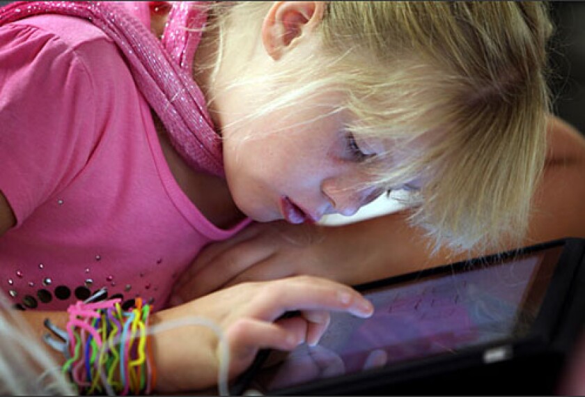 Jennifer Sloan, a 4th grade student at Summit View Elementary School in Independence, Ky. uses an iPad during a lesson. The northern Kentucky elementary school class received $30,000-worth of the tablet computing devices in late 2010 from the Duke Energy Corporation, for use in math and science assignments.