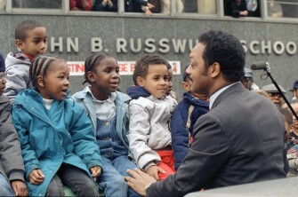 esidential hopeful Jesse Jackson speaks with a group of kindergarten children in New York’s Harlem, Tuesday, April 19, 1988 during his primary day campaigning. (AP Photo/Barry Thumma)