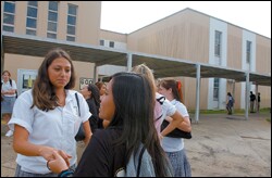 Junior Karen Villegas, left, talks with classmate Phiyen Nguyen during lunch at Bonnabel High. Villegas attended school in Houston for a week, an experience she calls "weird" because of the scant time she had to adjust.