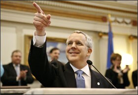 Oklahoma Gov. Brad Henry points to his wife in the Oklahoma House chamber, the site of his annual address to a joint session of the Oklahoma legislature.
