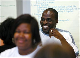 Terrell Williams, right, is part of this year’s crop of teachers in Baltimore from the New Teacher Project.