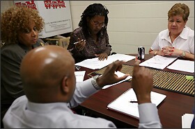 King School Principal Doris R. Hicks, left, attorney Tracie Washington, and Hilda Young, the president of the school’s board of directors, listen as Louisiana charter office director Kenneth Campbell talks with them about expanding to serve high school students.