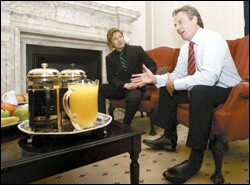 Popular chef Jamie Oliver, left, listens to British Prime Minister Tony Blair during a March meeting at 10 Downing Street in London.