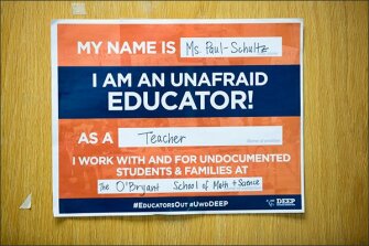A sign on teacher Nora Paul-Schultz’s classroom door announces her support for undocumented students at Boston’s John D. O’Bryant School of Mathematics and Science.