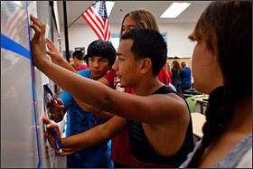 Students in Garza’s English class separate into learning groups, a strategy the teacher says frees up more time for him to give individualized attention to each student and allows students progressing at similar levels to help each other.