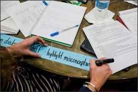 Assistant principals Lindsey McCormick, center, of Lockerman Middle School, writes down her team's solutions that were posted on the conference room walls during a quarterly retreat for the Governors Promising Principals Academy in Maryland, at the Sheraton in Annapolis, MD on Dec. 9, 2014. The academy is a yearlong training program that prepares assistant principals to run their own schools.