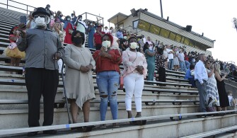 Families wore masks and practiced social distancing during Central High School’s first of five live graduation ceremonies at Garrett-Harrison Stadium in Phenix City, Ala.