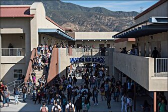 Students stream to their classes at Summit High. The school credits its peer-mentoring program with helping to reduce course-failure rates during the critical 9th grade year. Fewer students are also taking remedial classes or going to summer school.