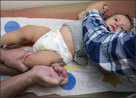 Pediatrician Charles Goodman vaccinates 1-year-old Cameron Fierro with the measles-mumps-rubella, or MMR, vaccine at his practice in Northridge, Calif., last month.