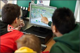 Using the game, Mr. Farber’s students must balance the growth of their cities with environmental impacts like pollution.