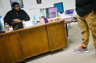 Chrissell Rhone casts a look at a student after the youth mentioned how many times he had been placed under house arrest.