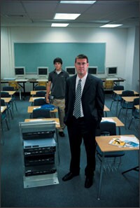 Jared P. Mader used tech-savvy seniors, such as Jonah Caldwell, at left, to build two computer servers last school year.