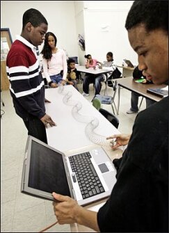 Lab Work: At Parkway Academy of Technology and Health, 9th graders conduct a test.