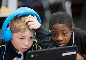 Amity Elementary 5th graders Sam Carlisle, left, and Malikai Parker spend time on the Happify platform, a digital teaching tool that emphasizes character development. Amity Elementary is part of the Deer Park Community City Schools in Cincinnati.