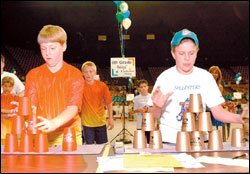 Students compete in cup-stacking.