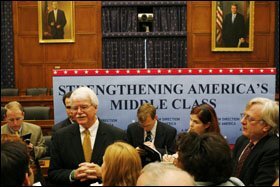 With hands clasped, Rep. George Miller, D-Calif., answers reporters' questions last week about his priorities for when he becomes chairman of the House education committee.