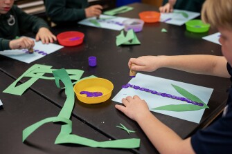 Students recreate a lilac plant through an activity that incorporates fine and gross motor skills during art class on March 30, 2023.