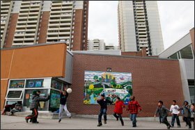 Students play during recess outside the Crescent Town Public School in the Toronto school system. Designed to be a part of the Crescent Town community, the school offers programs for both parents and children.