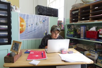 Connor Maxcy works on a project during the school day last June at the Isle au Haut school.