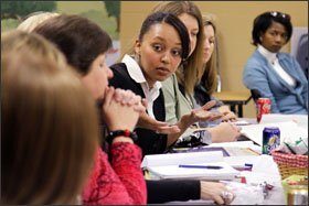 First grade teacher Torrie C. Achan, center, talks with other teachers during a professional-development session at Theodore Jones Elementary School in Conway, Ark. The school used part of the money it received through the federal economic-stimulus program to expand professional development.