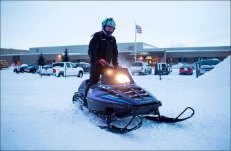 Marshall Hahn parks his snowmobile at Warrod High School in northern Minnesota. Although the senior had no trouble getting to campus, bouts of very cold and snowy weather in many states kept students out of school, often for days at a time, during the winter of 2013-14.