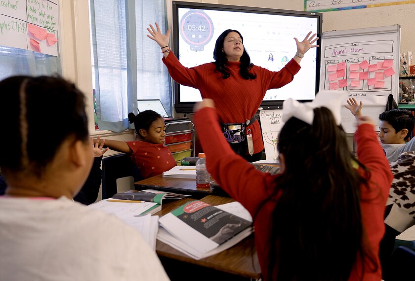 Victoria Jorden, a 3rd grade teacher at Gray Court-Ownings School, leads students through a yoga exercise during class in Gray Court, S.C., on Dec. 10, 2024.