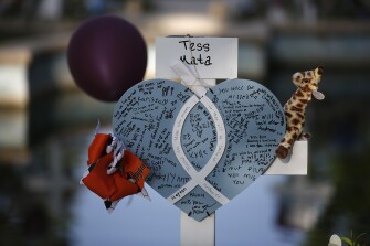Tess Mata's cross stands at a memorial site for the victims killed in this week's shooting at Robb Elementary School in Uvalde, Texas, Friday, May 27, 2022.
