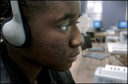 A student listens to a composition during music class.