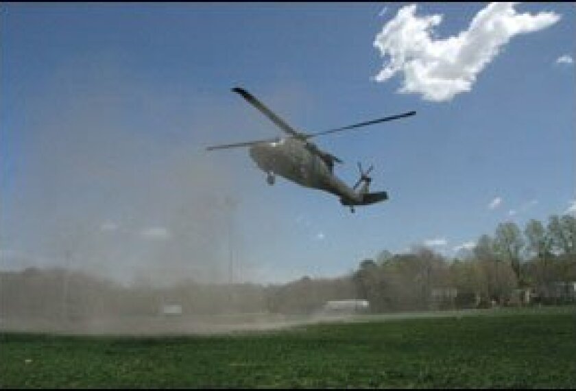 Free helicopter flights draw educators into a military recruitment drive.