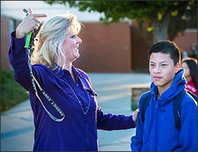 After blowing a whistle, Sandi Peterson, a counselor at Harriet Eddy Middle School in Elk Grove, Calif., points to 14-year-old Shane Mar to draw attention to the fact that Shane donated a Halloween costume for homeless children. Peterson is part of an effort to recognize leadership in identifying gifted students.