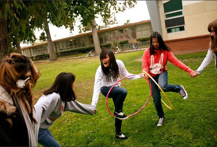 Sophomore Valerie Luong, center, and Kelly Wong, right, take part in an ice breakers exercise, part of their Techbridge program at Arroyo High School in San Lorenzo, California. Techbridge is an after-school program for girls that focuses on science and engineering.