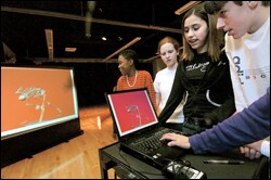 Eighth graders fine tune a virtual dance they choreographed.