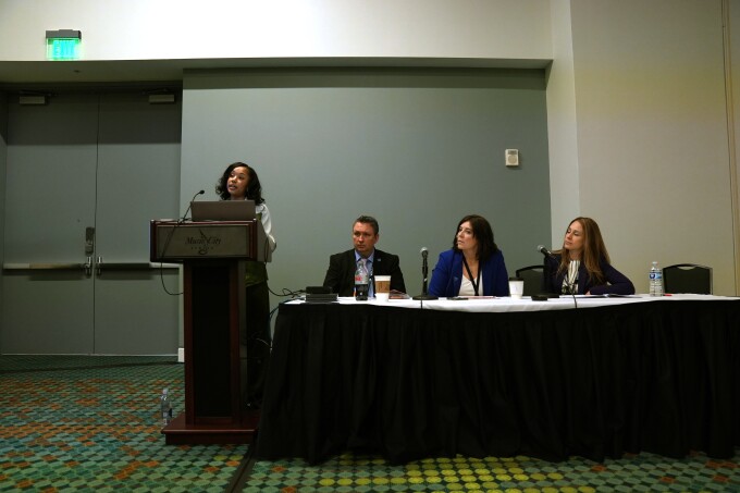 A panel on risky behaviors and district challenges kicks off at the National Conference on Education in Nashville, Tenn. on Feb. 12, 2026. At the podium is Ashley Dawson, senior project coordinator of children's programs at AASA. At the table, from left: Michael Vuckovich, superintendent of the Windber Area school district; Korie Duryea, the district's special education director; and Jessica Shuster, the director of education.