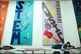 Twelve-year-old Bailey Freeman, left, and Christopher Clark, 11, work on a Mars Rover project in a corner of the "cafegymatorium" at the North Idaho STEM Charter Academy in Rathdrum. The 317-student K-8 school opened in 2012 but already has a waiting list of 300 students.