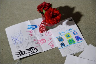 Flowers and cards in front of Saugus High School in Santa Clarita, Calif., in the aftermath of the shooting that killed two students and injured several others, including the alleged student gunman.