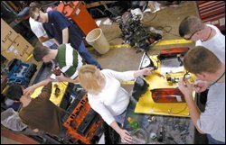 Students at B.J. Skelton Career Center in Easley, S.C., study electrical systems as part of their automotive technology class. Courses like this one will become more common under a new South Carolina education law.