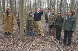 The 40-year-old Watkins takes camouflaged students into the Peddie School woods for simulation war exercises.