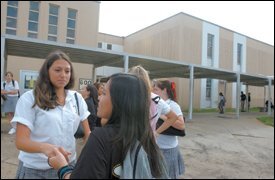 After evacuating to Houston with her family, junior Karen Villegas, left, spent a week attending school there. "It was weird," she says of the experience.