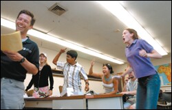 Students compete in a game of "SAT Jeopardy" run by instructor Todd Gutmann, left.