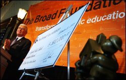 Eli Broad, the president of the Broad Foundation, applauds the Norfolk, Va., schools last week after announcing that the district won the foundation's prize for urban education.