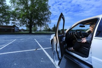 A portrait of third-grade teacher Karen Ruark outside her elementary school, South Dorchester School, on April 28, 2020.
