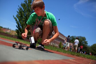 David Mosco, 14, test drives his solar-powered car, which he built in Principles of Engineering Design class during Center for Talented Youth summer program at Lafayette College.