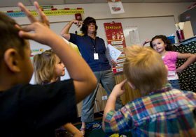 Preschool teacher Julie Flint leads her class in a Tools of the Mind lesson called the “Freeze Game” at Foster Elementary School in Arvada, Colo.