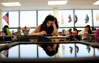 In this 2014 photo, Nimra Mian and other 7th graders at Marshall Simonds Middle School in Burlington, Mass., field test a common-core exam. New teacher evaluations were rolled out alongside the Common Core State Standards and related exams, leaving teachers concerned about how the harder tests will affect their performance evaluations in the future.