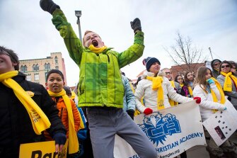 Sixth-grader Sam Ross cheers for his school, the Evangelical Christian School, on Jan. 24 during a school choice rally on the steps of City Hall in Colorado Springs, Colo.